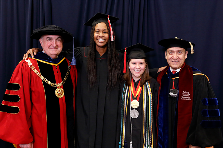 President Michael McRobbie, Chancellor Nasser Paydar, Amber Kriech, and the other commencement speaker.