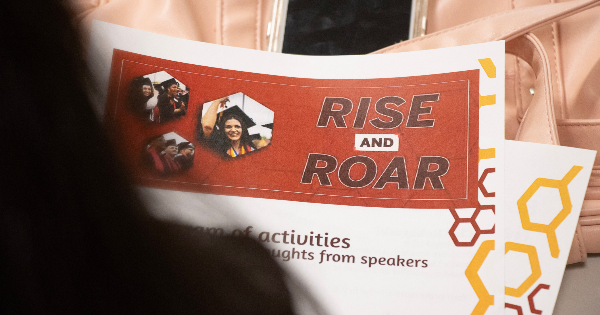 Rise and Roar flyer on desk